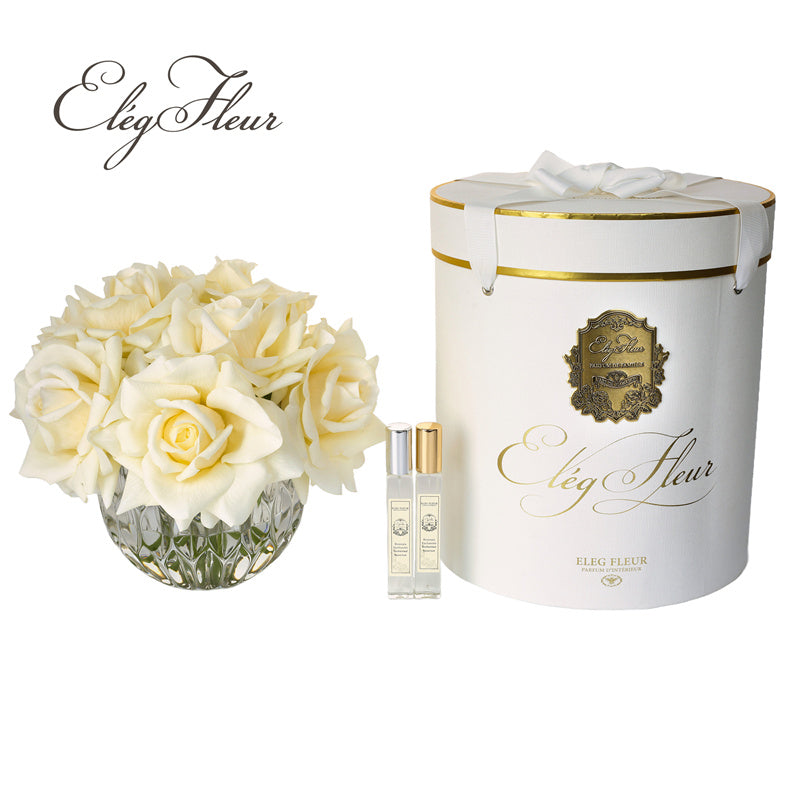 White rose bouquet in spherical glass vase
