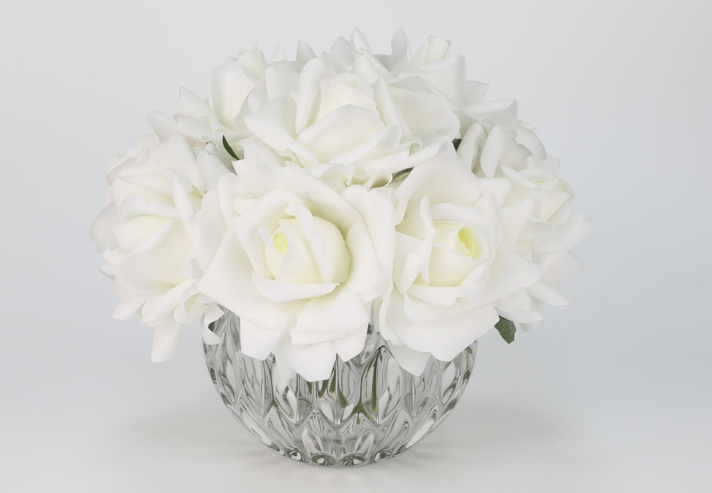 White rose bouquet in spherical glass vase