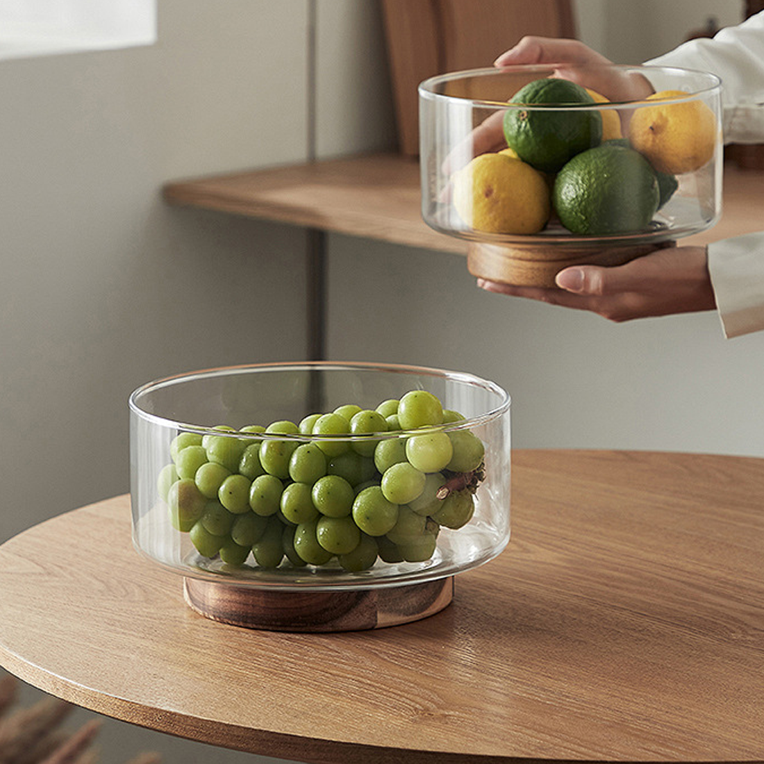 Glass footed bowl with wooden base