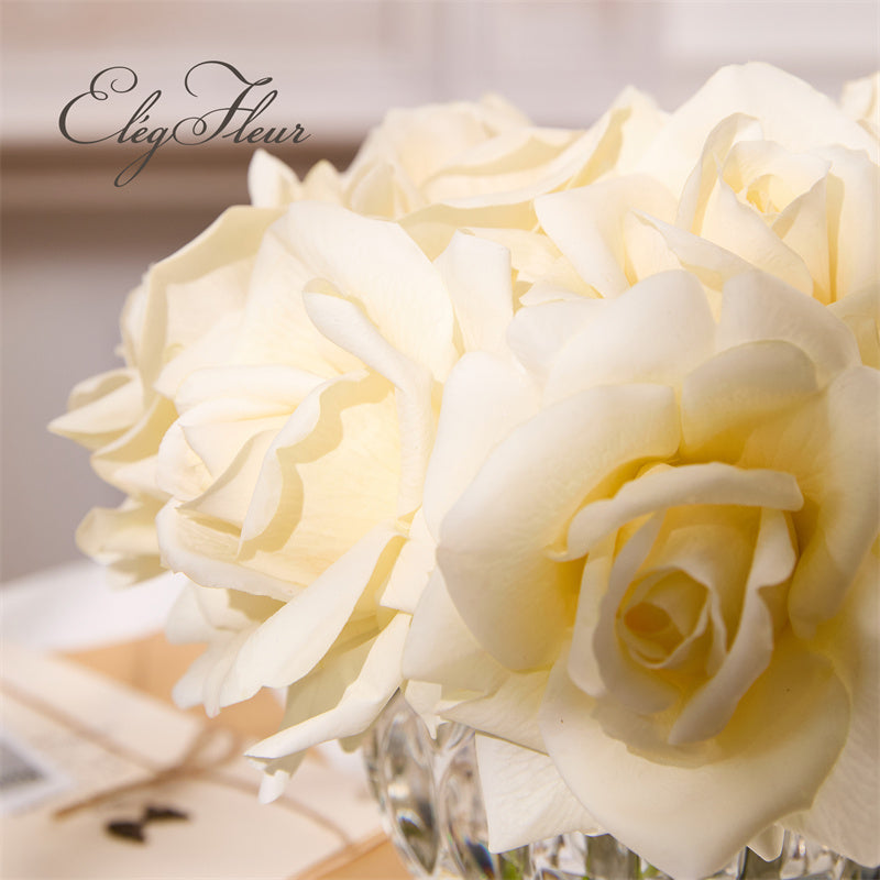 White rose bouquet in spherical glass vase