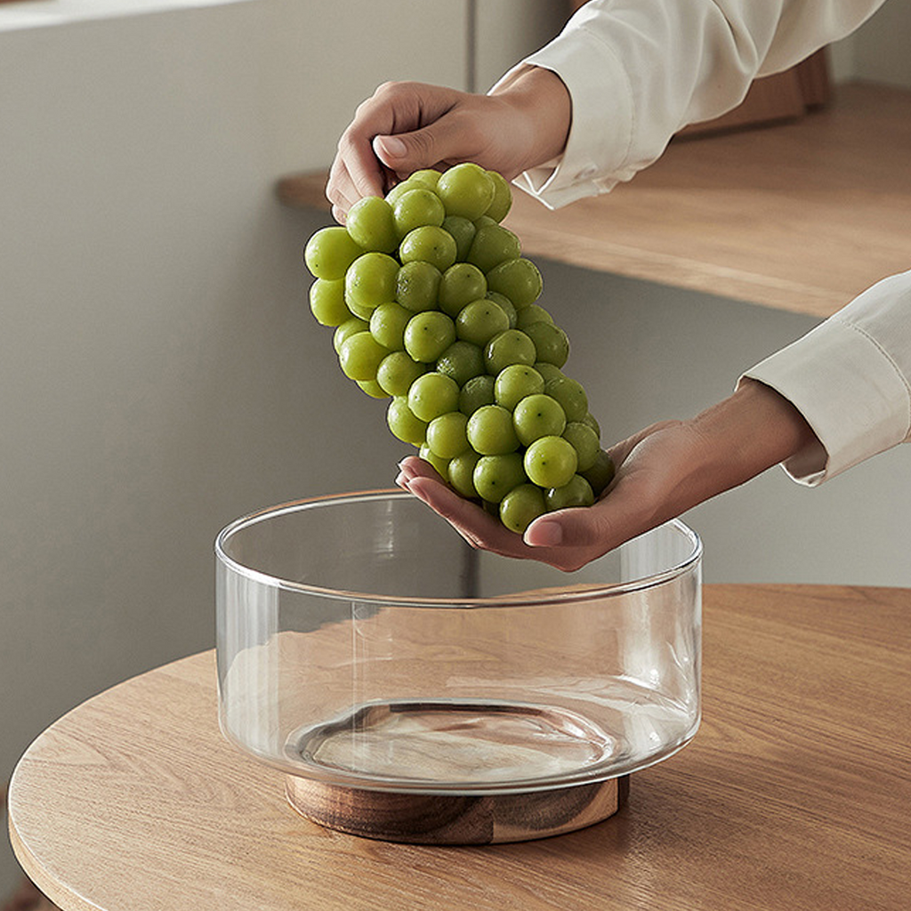 Glass footed bowl with wooden base