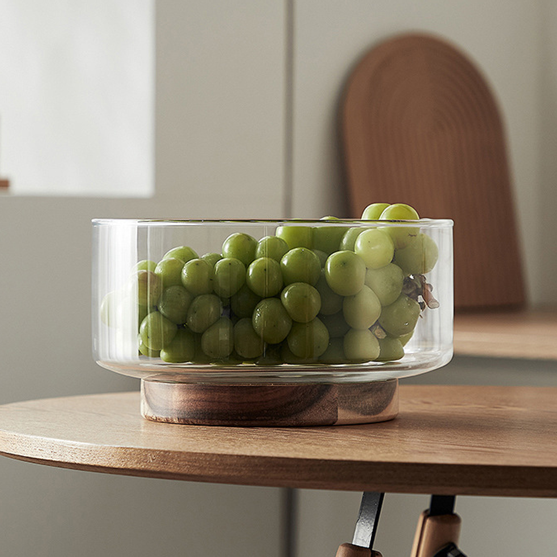 Glass footed bowl with wooden base