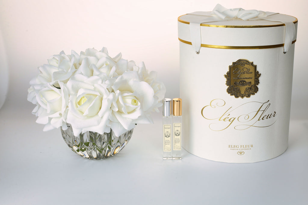 White rose bouquet in spherical glass vase