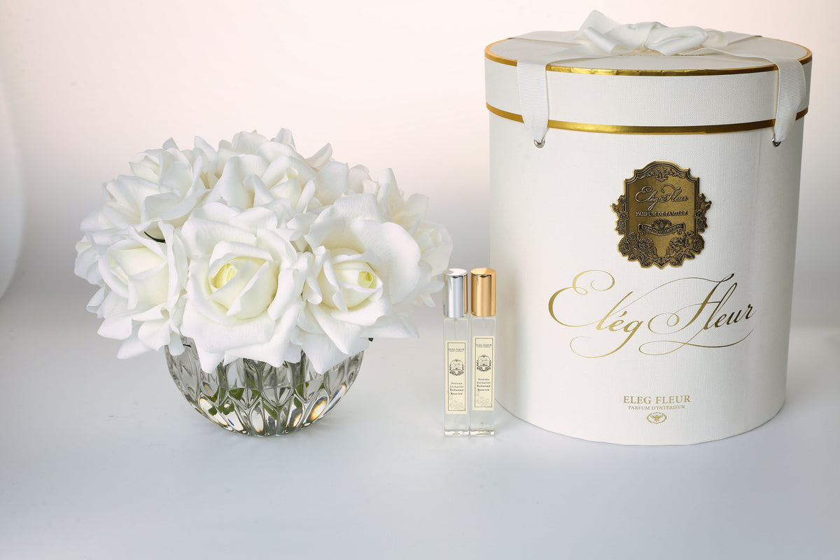 White rose bouquet in spherical glass vase